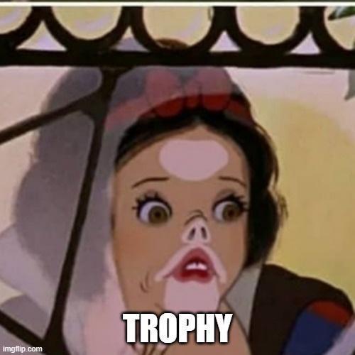 A close-up of Snow White from Disney's animated film, showing her face with wide, shocked eyes and an open mouth, as if…