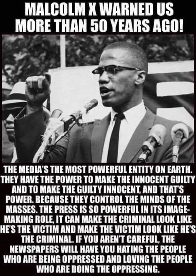 A black-and-white photo of Malcolm X speaking at a podium with multiple microphones, raising his right fist. Overlaid text…