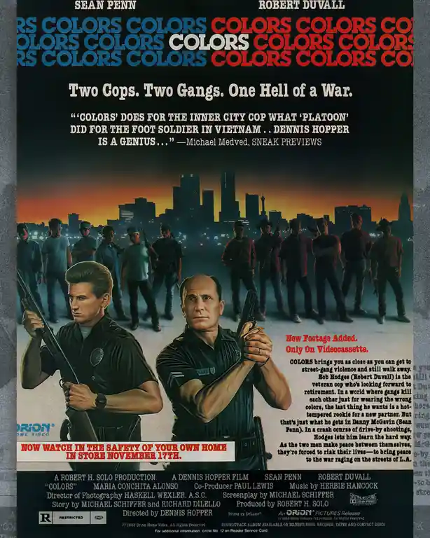 This is a movie poster for the 1988 film 'Colors,' featuring actors Sean Penn and Robert Duvall as two police officers…