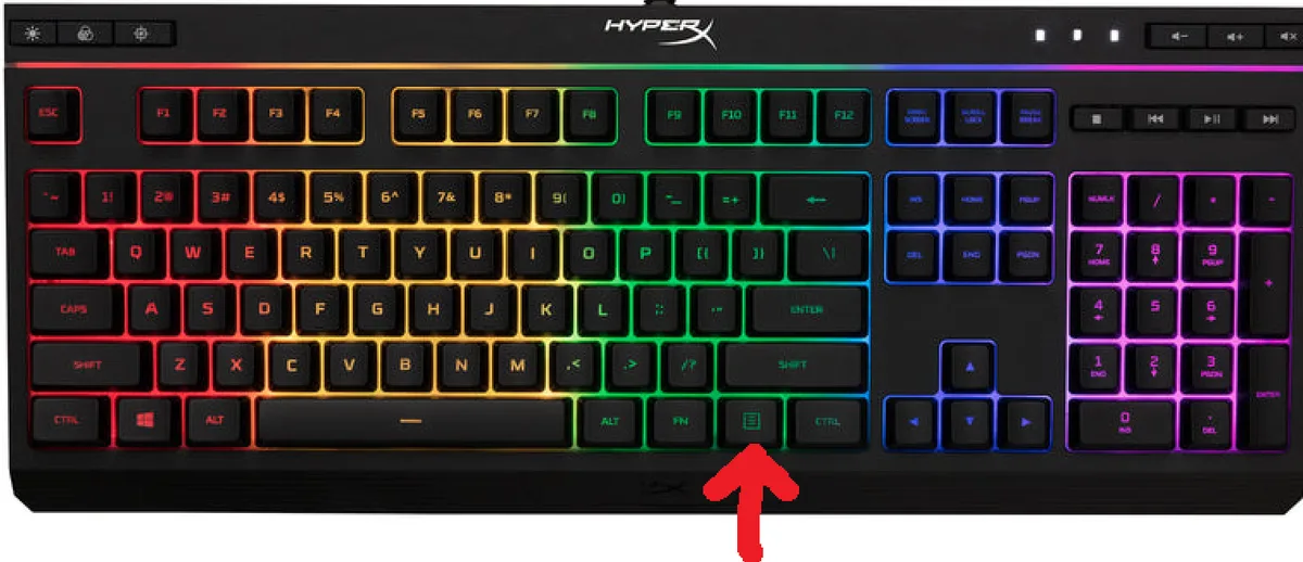 a black hyperx mechanical keyboard with rainbow backlighting, featuring a large red arrow pointing directly at the enter…