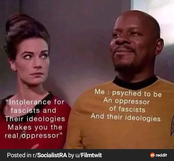 A still from Star Trek: The Next Generation shows a woman in a red uniform looking skeptically at a man in a yellow uniform…