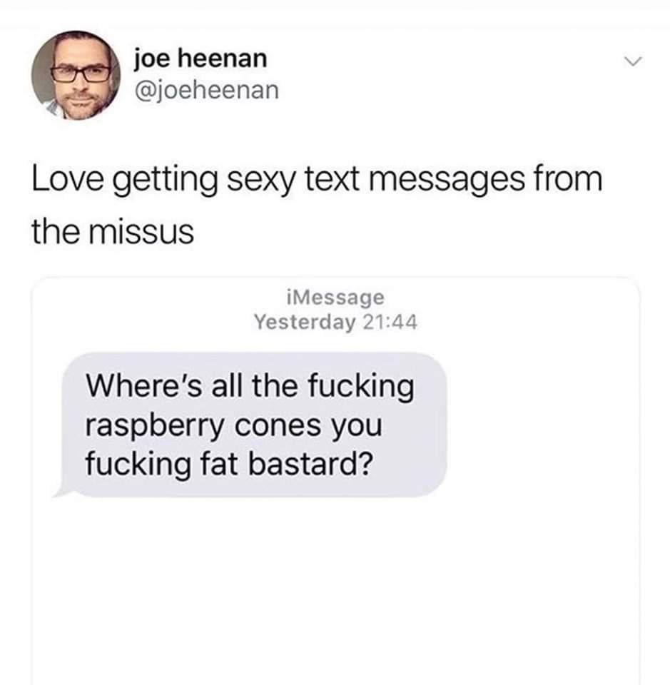 A screenshot of a tweet by Joe Heenan showing a text message conversation. The tweet reads 'Love getting sexy text messages…