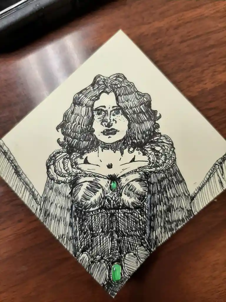 A hand-drawn black-and-white illustration on a square piece of paper depicts a woman with curly hair, wearing a detailed…