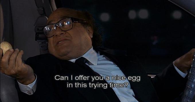 A man in a suit and glasses sits in a car at night, holding an egg in one hand and a bottle in the other. The overlaid text…