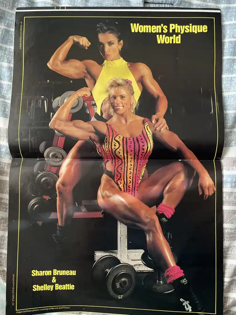 A vintage magazine spread from 'Women's Physique World' featuring two muscular women, Sharon Bruneau and Shelley Beattie…