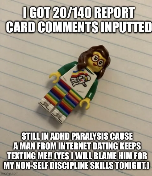 A lego minifigure with brown hair and glasses, wearing a white t-shirt with a rainbow-striped design and green sleeves, lies…