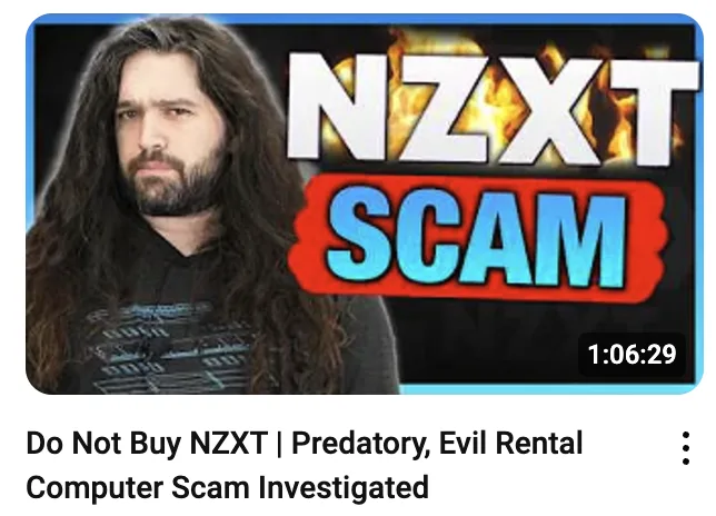 A man with long dark hair and a beard looks serious while the text 'NZXT SCAM' is overlaid in large, fiery letters. Below…