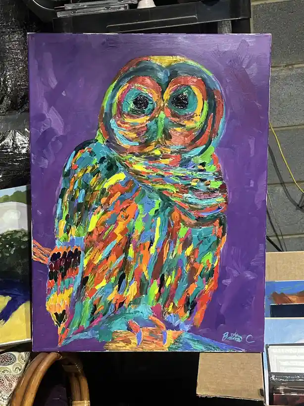 A vibrant, abstract painting of an owl with swirling, multicolored brushstrokes against a solid purple background, signed…
