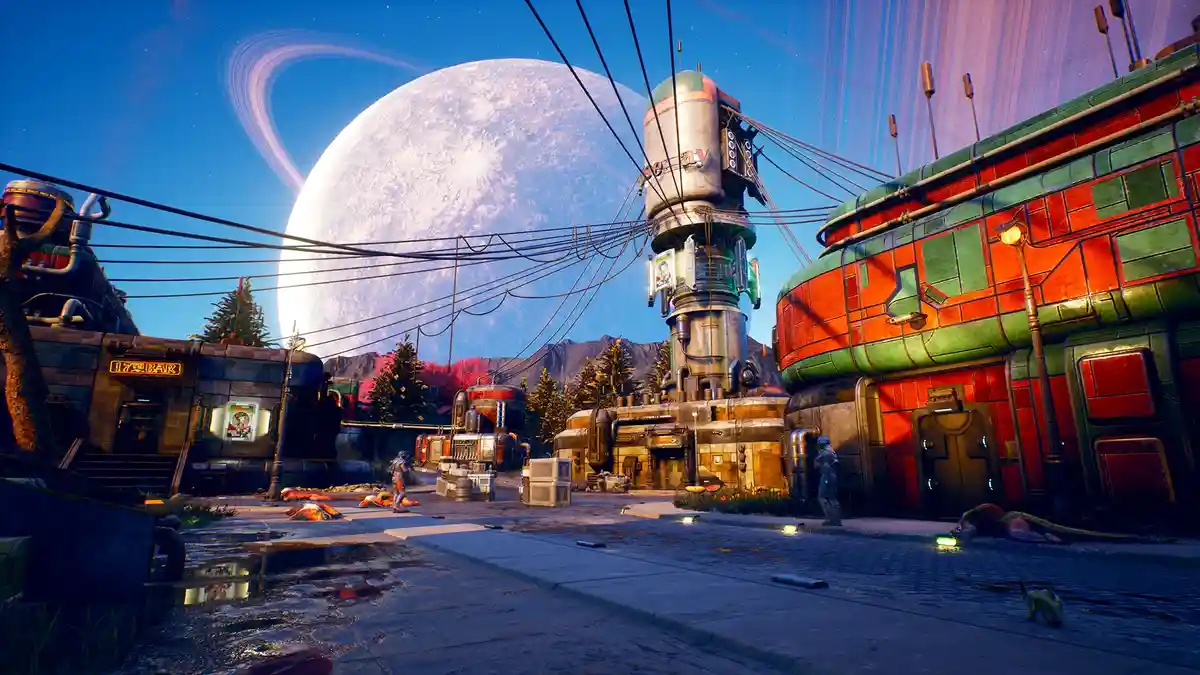 A vibrant sci-fi scene from a video game shows a futuristic alien town with colorful buildings, a giant ringed moon in the…
