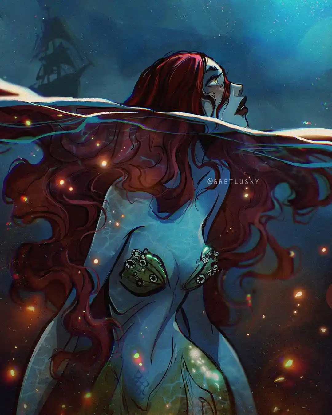 A mermaid with long red hair and a green seashell top floats underwater, half-submerged, looking upward with a serene…