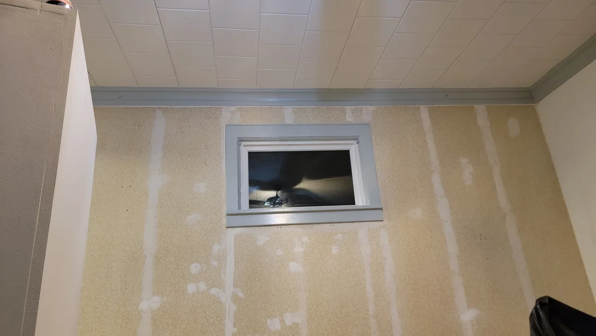 How Can I Block Light from This Window Above My TV?