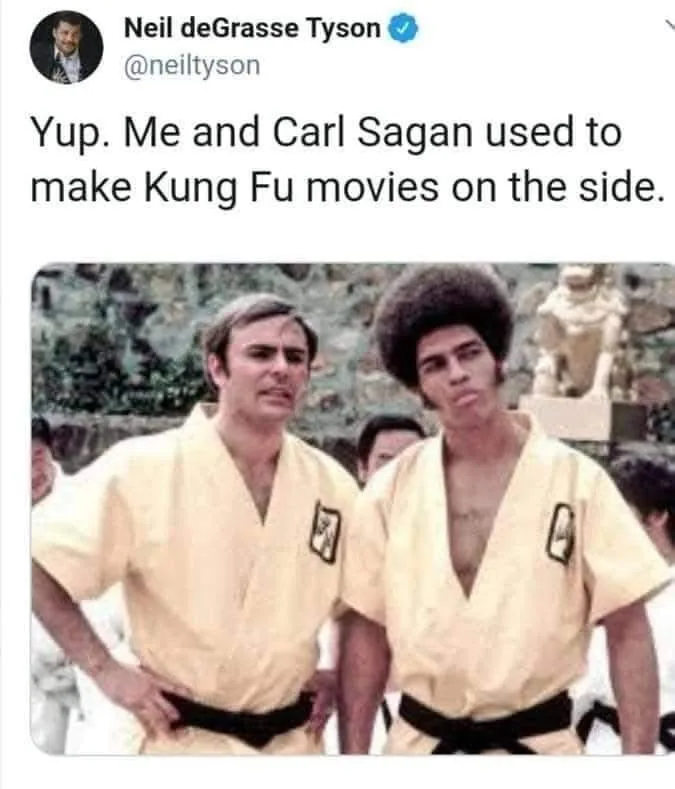 A screenshot of a tweet from Neil deGrasse Tyson showing a photo of two men in yellow martial arts uniforms with black belts…