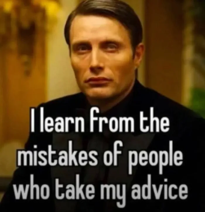 A still image of actor Mads Mikkelsen with a serious, slightly smug expression, overlaid with white text that reads 'I learn…