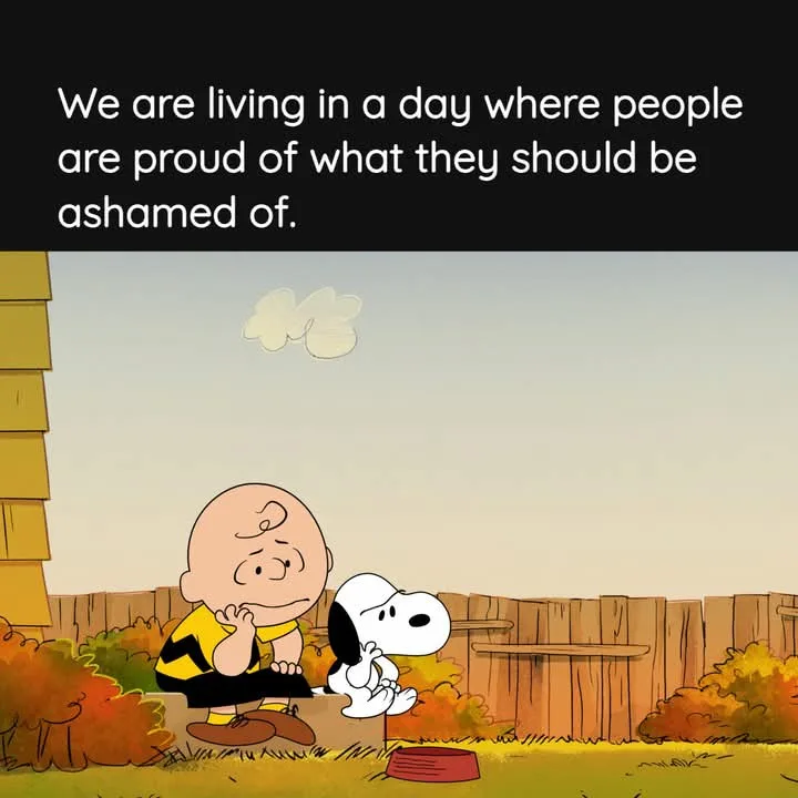 A cartoon image shows Charlie Brown sitting on a low wall outdoors with his dog Snoopy beside him. Charlie Brown has a sad…