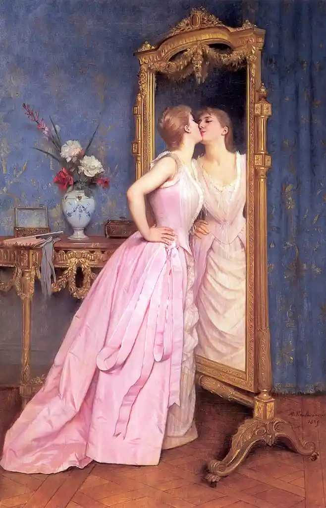 A woman in a pink dress kisses her reflection in an ornate gold-framed mirror in a lavishly decorated room with blue…