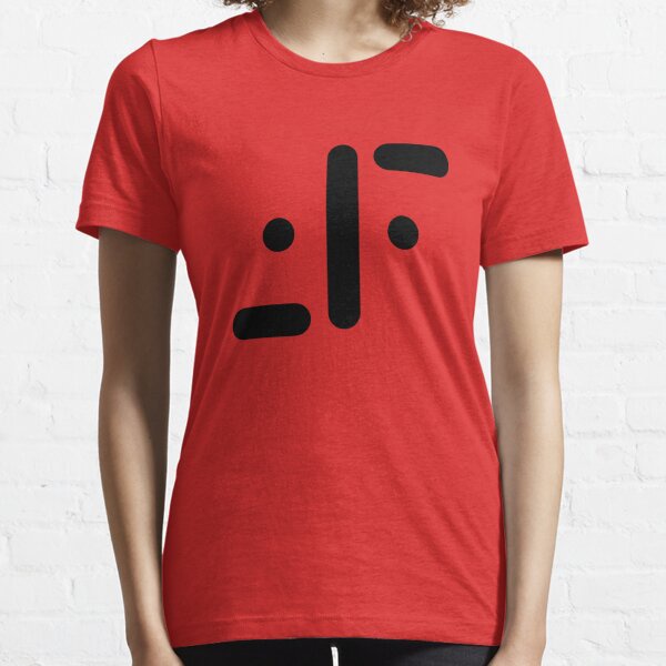 A person wearing a red t-shirt with a black minimalist graphic resembling a face with dots for eyes and a horizontal line…