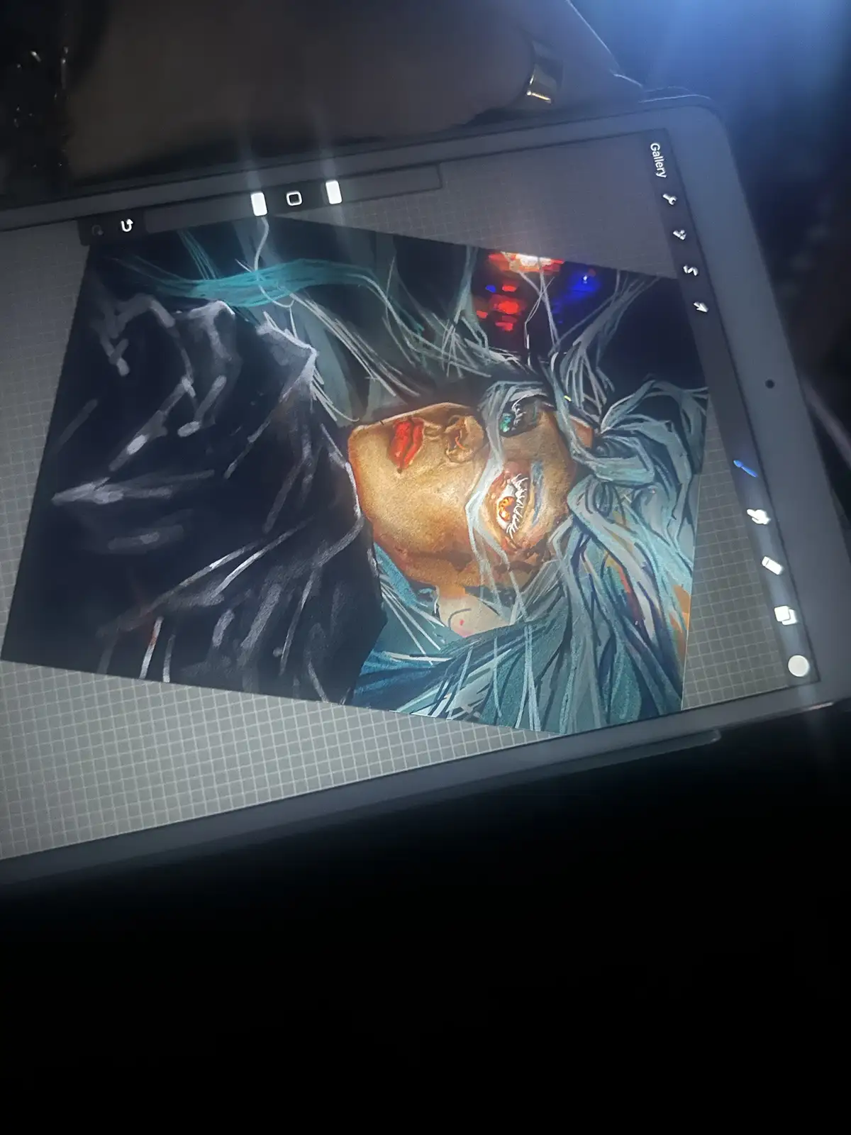 A digital drawing displayed on a tablet screen shows a stylized character with pale skin, glowing eyes, and blue hair…