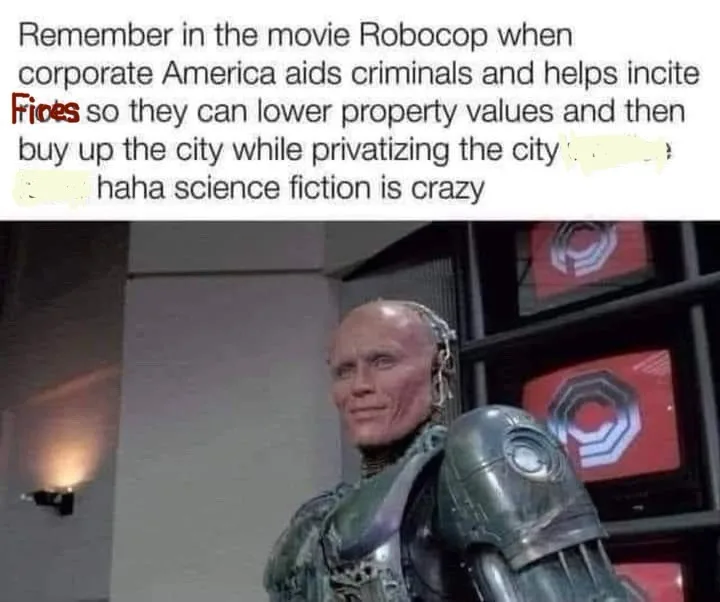 The image shows the character Robocop from the movie, standing in a dimly lit room with monitors in the background. The…