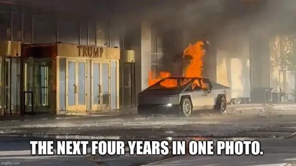 A Tesla Cybertruck is on fire in front of a building with a 'TRUMP' sign above its entrance. Thick smoke billows from the…