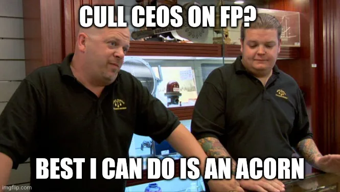 Two men in black polo shirts sit at a counter in what appears to be a restaurant or bar. The man on the left looks surprised…