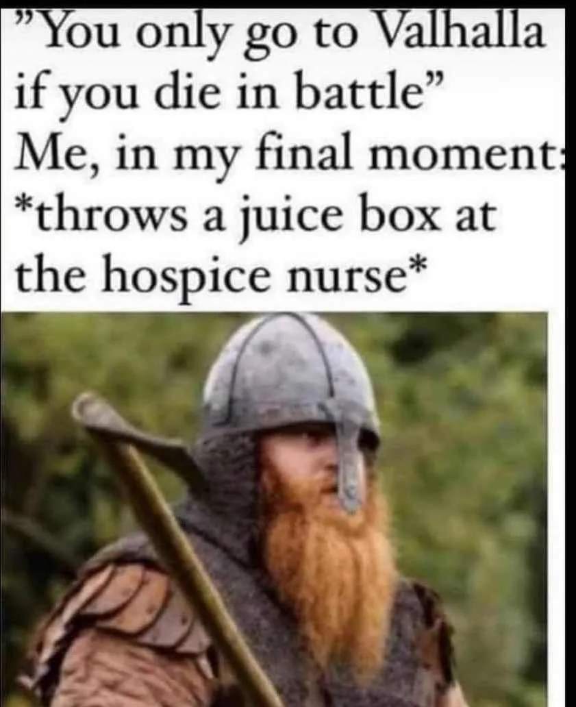 A man in Viking armor with a long red beard and helmet, holding an axe, looks off to the side. The text above him reads…