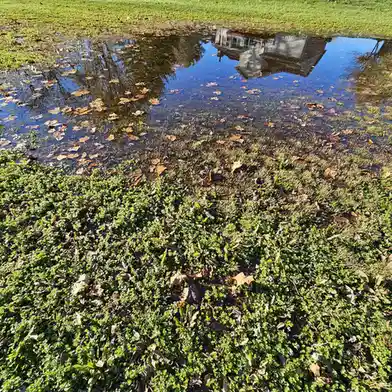 A gigantic puddle with a house right in the middle