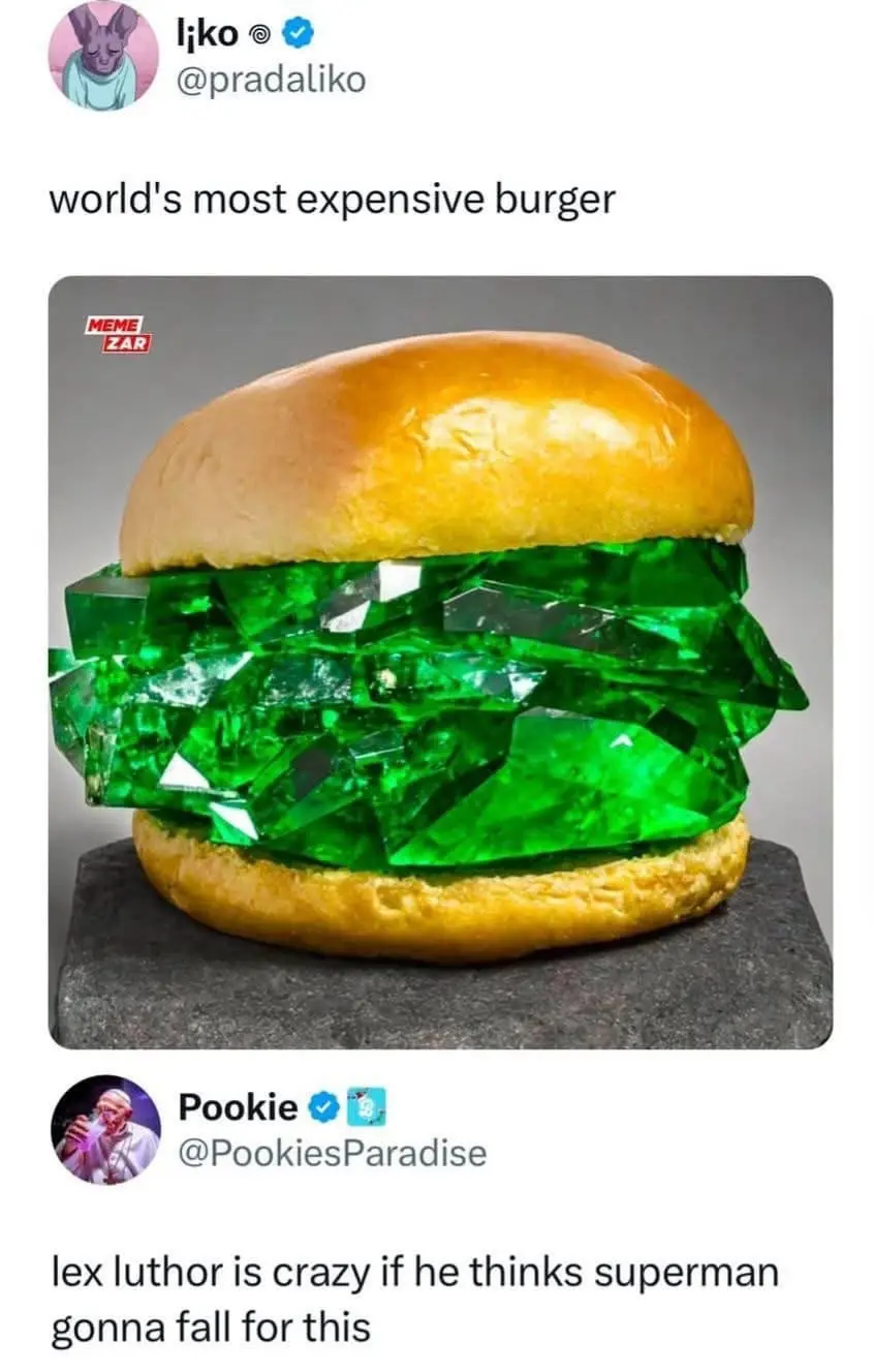 An image of a burger with green gem-like crystals as the patty, presented on a dark stone slab. The overlaid text reads…