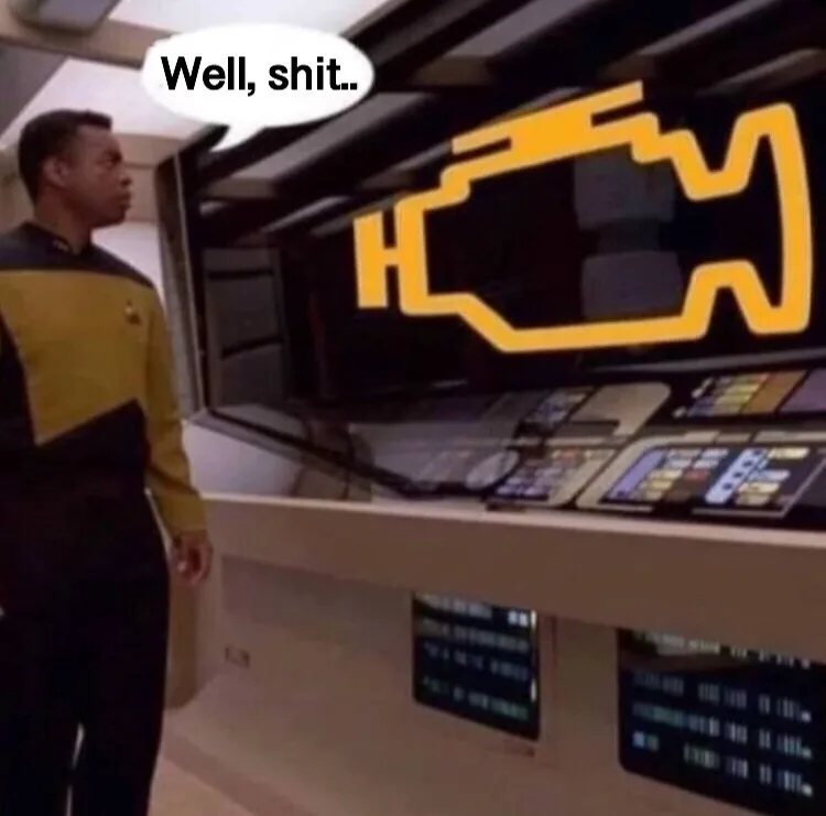 A man in a Starfleet uniform from Star Trek: The Next Generation stands in a spaceship control room, looking at a large…