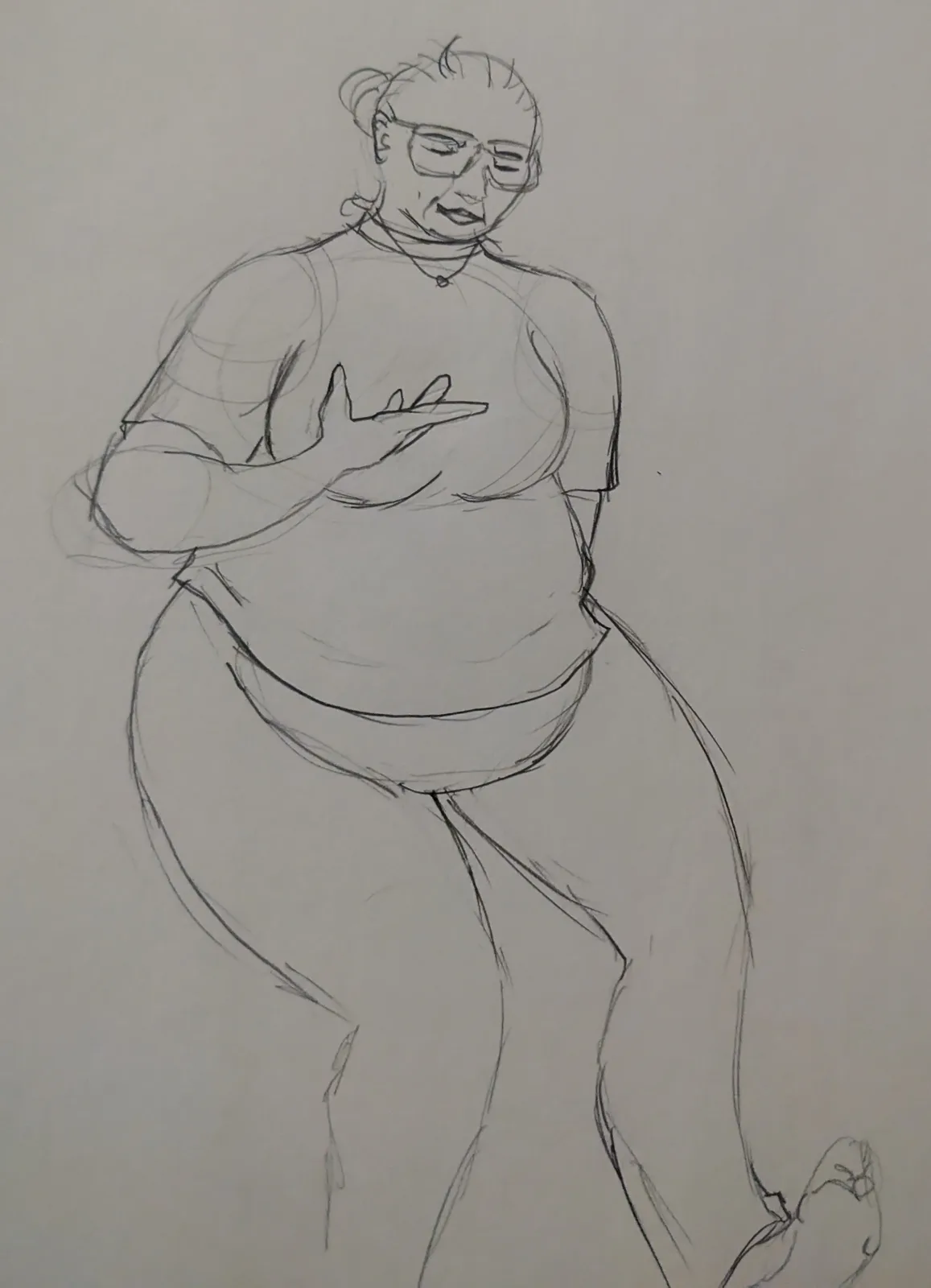 A rough pencil sketch of a person with glasses and their hair in a bun, wearing a t-shirt and pants, gesturing with one hand…