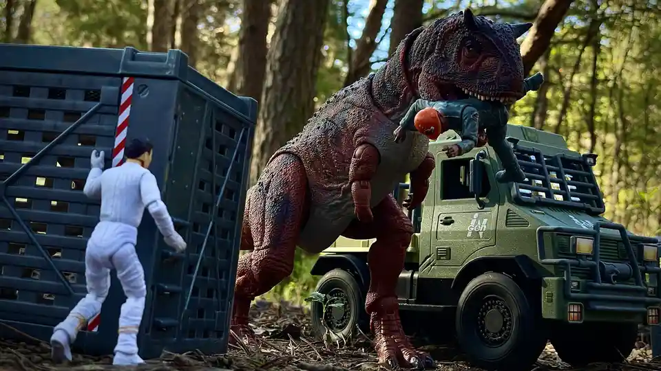 A toy action figure in a white jumpsuit is climbing a large blue crate in a forest, while a large red and grey dinosaur toy…