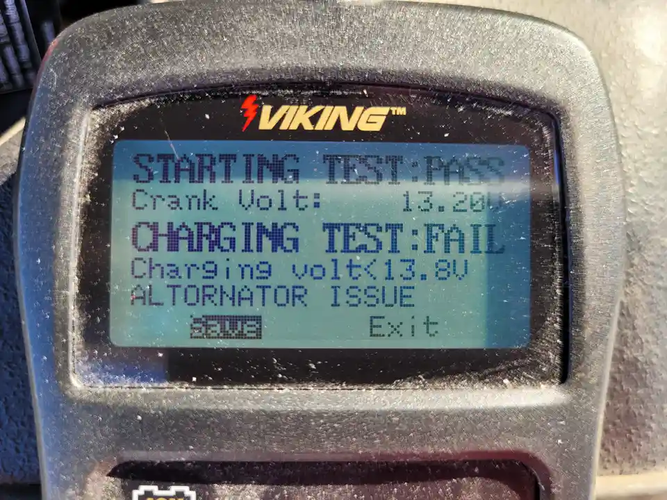 A close-up of a Viking brand battery tester's screen showing a passing starting test but a failing charging test due to an…