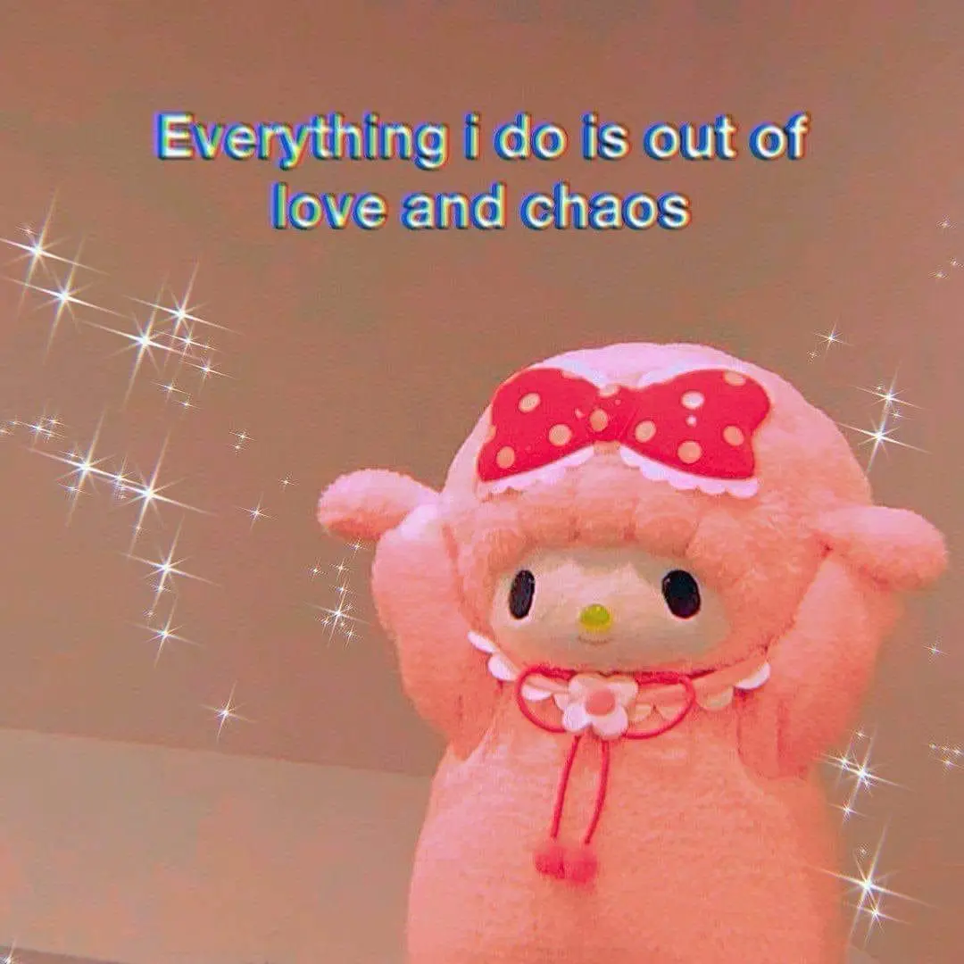 A pink, fluffy plush toy resembling My Melody stands with arms raised against a soft brown background, adorned with…