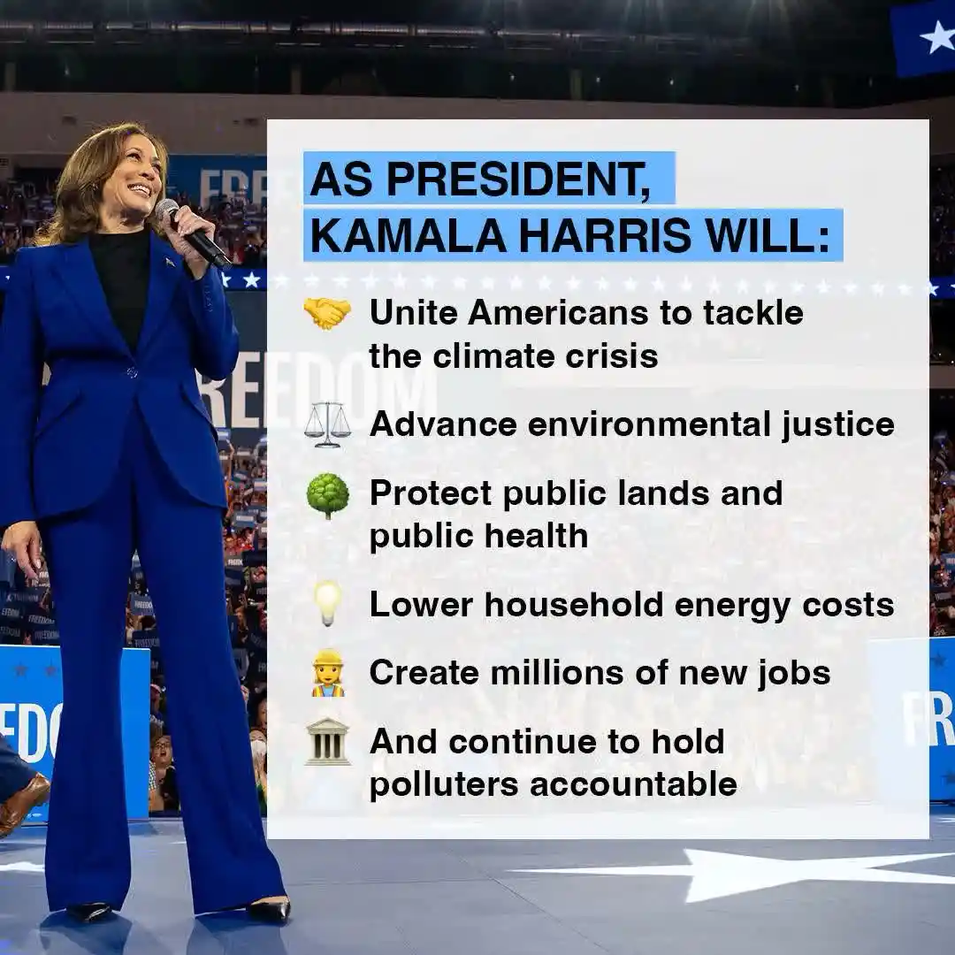 A photo of Kamala Harris speaking at a rally, wearing a blue suit and holding a microphone, with a large white text box…