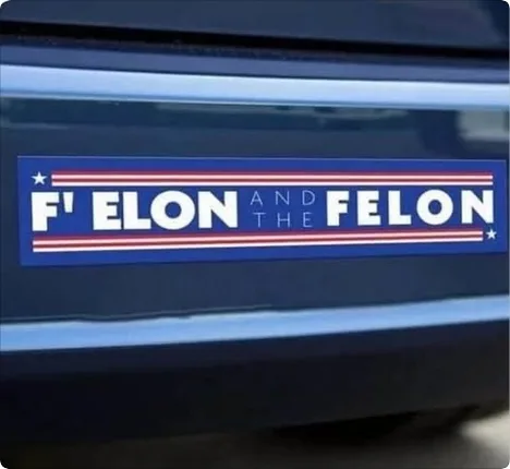 A blue bumper sticker with red and white stripes and stars, featuring the text 'F' ELON AND THE FELON' in white capital…