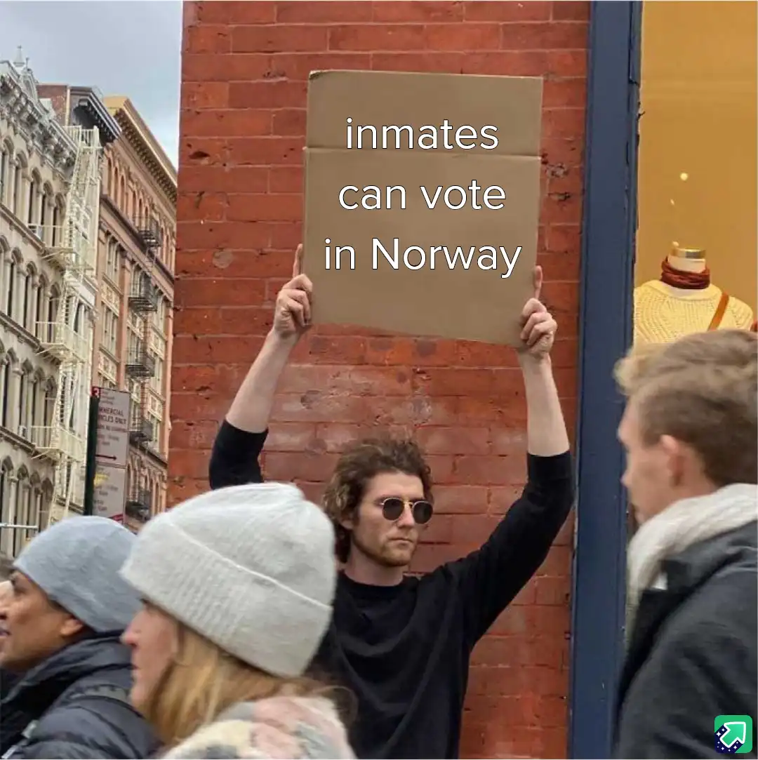 A man with curly hair and sunglasses holds up a cardboard sign that reads 'inmates can vote in Norway' while standing on a…