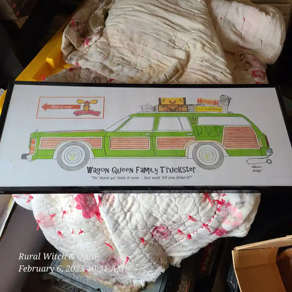 A framed illustration of a green station wagon with wood paneling, labeled 'Wagon Queen Family Truckster', sits atop a…