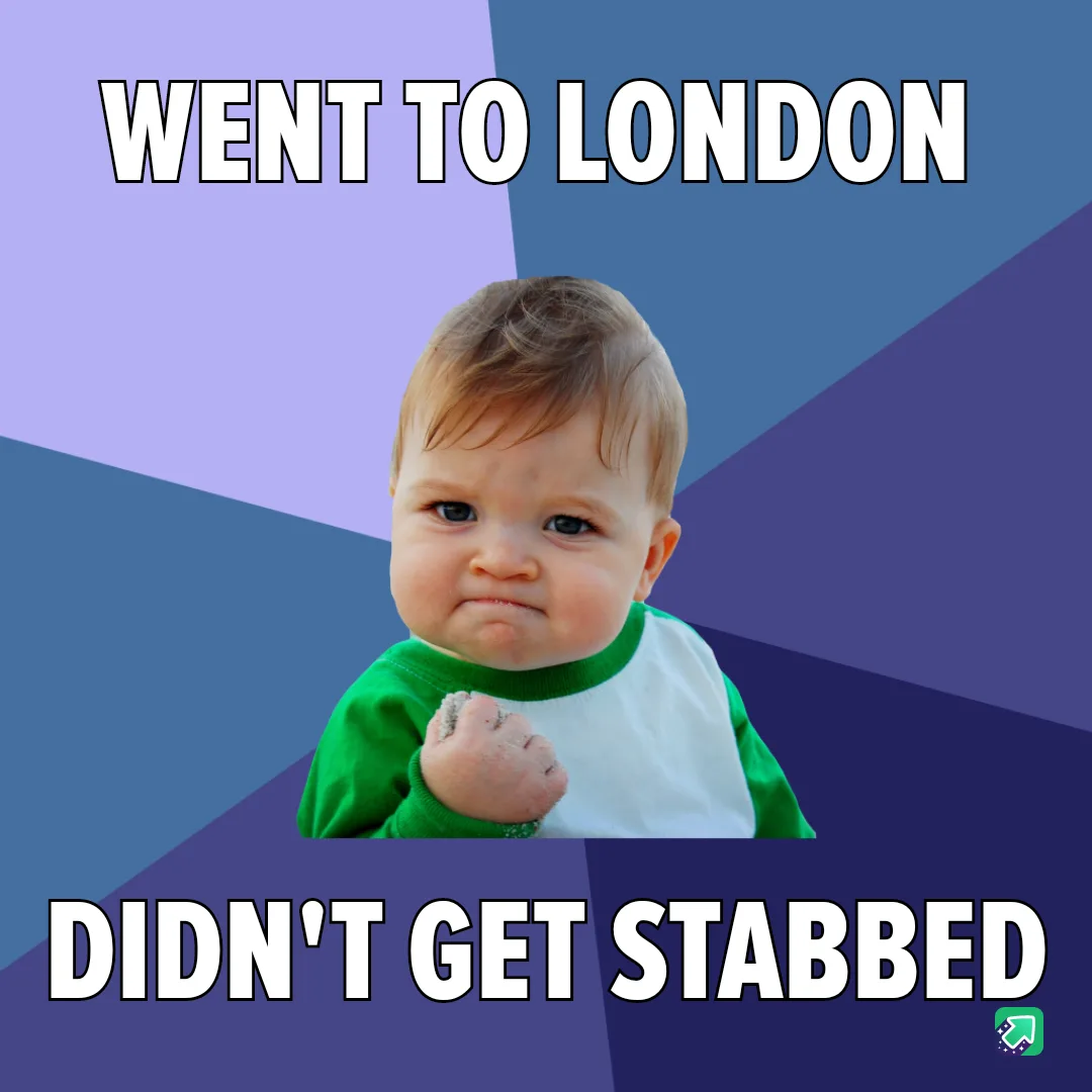 A baby with a smug, triumphant expression, wearing a green and white shirt, clenches a fist with sand on it. The image has a…
