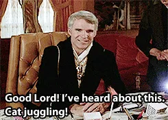 A six-panel image grid shows a man in a black suit and gold chain sitting in a leather chair, reacting with escalating shock…