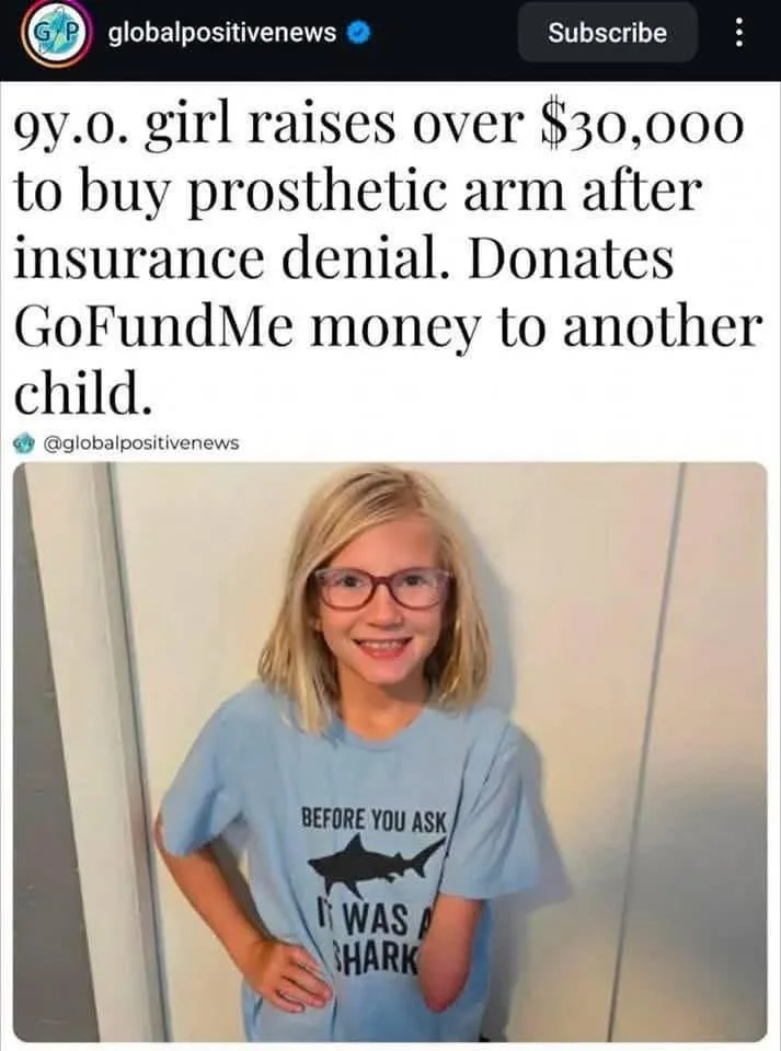 A smiling 9-year-old girl with blonde hair and glasses wears a light blue t-shirt that says 'BEFORE YOU ASK IT WAS A SHARK'…