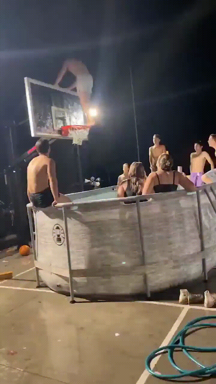 A sequence of images shows a person jumping from a basketball hoop into a pool at night, with onlookers watching. The person…