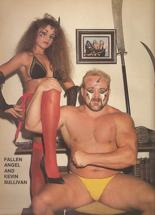 A vintage photo shows wrestler Kevin Sullivan seated, wearing yellow trunks and face paint with lightning bolts, while a…