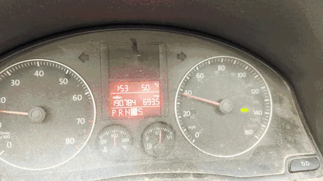 A car dashboard with a speedometer and digital display showing '153' mph, '190784' miles, and '6935' RPMs, overlaid with the…