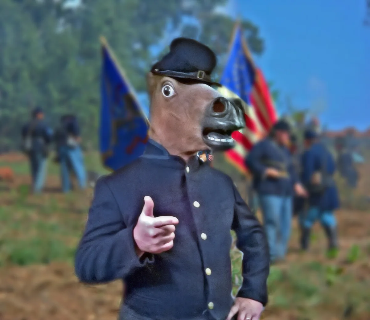 A person wearing a horse head mask and a Civil War-era Union soldier uniform stands in the foreground, pointing at the…