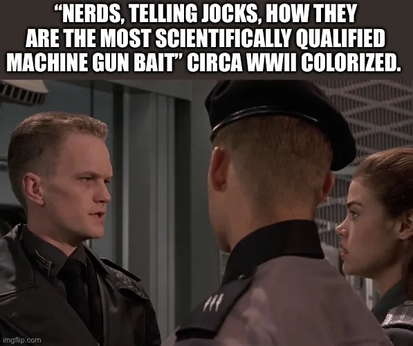 A still from the TV show 'The West Wing' shows actor Bradley Whitford as a stern-looking man in a dark uniform speaking to…