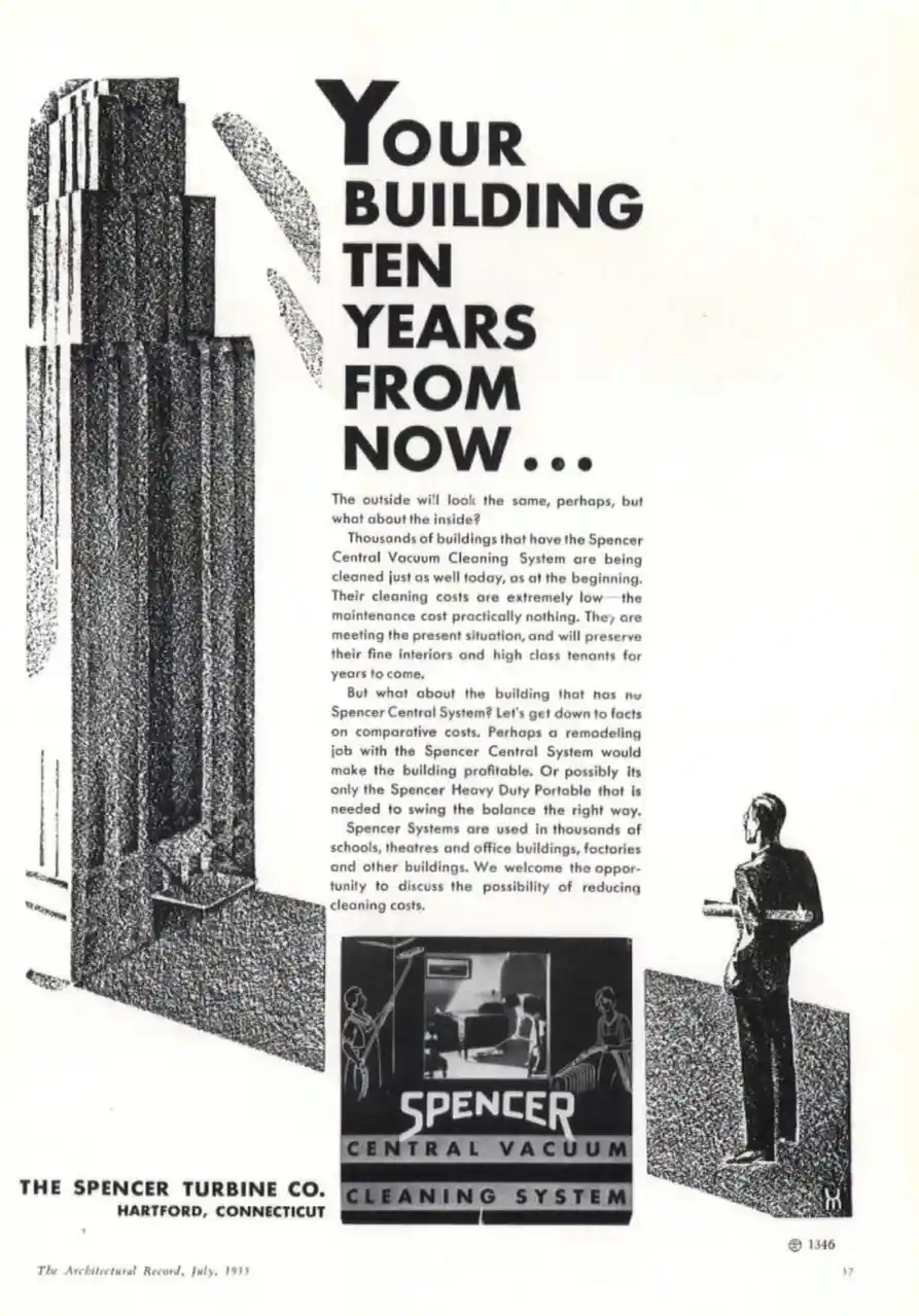 A vintage 1933 black-and-white advertisement for Spencer Central Vacuum Cleaning System features a tall Art Deco building, a…
