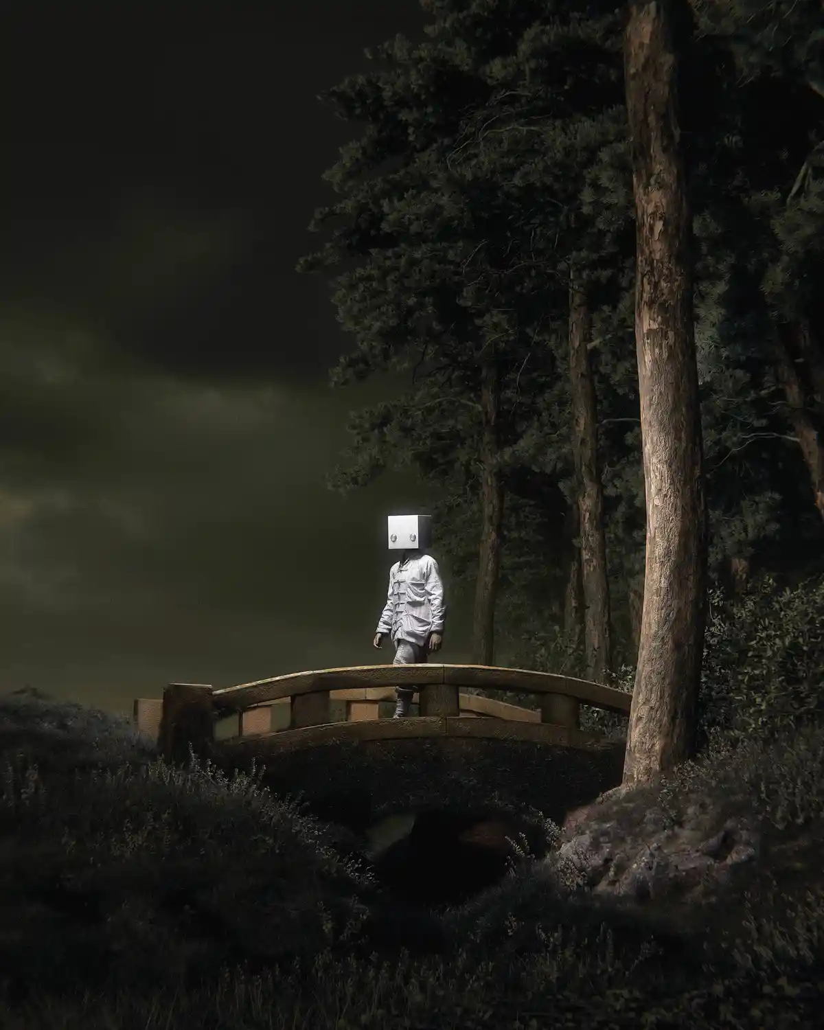 A person wearing a white box head with two circular eyes stands alone on a wooden bridge in a dark, misty forest. The figure…