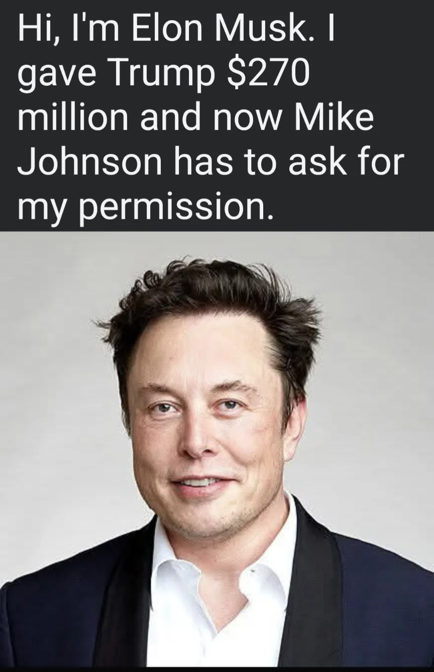 The image shows a headshot of Elon Musk smiling, wearing a dark suit jacket over a white collared shirt against a plain…