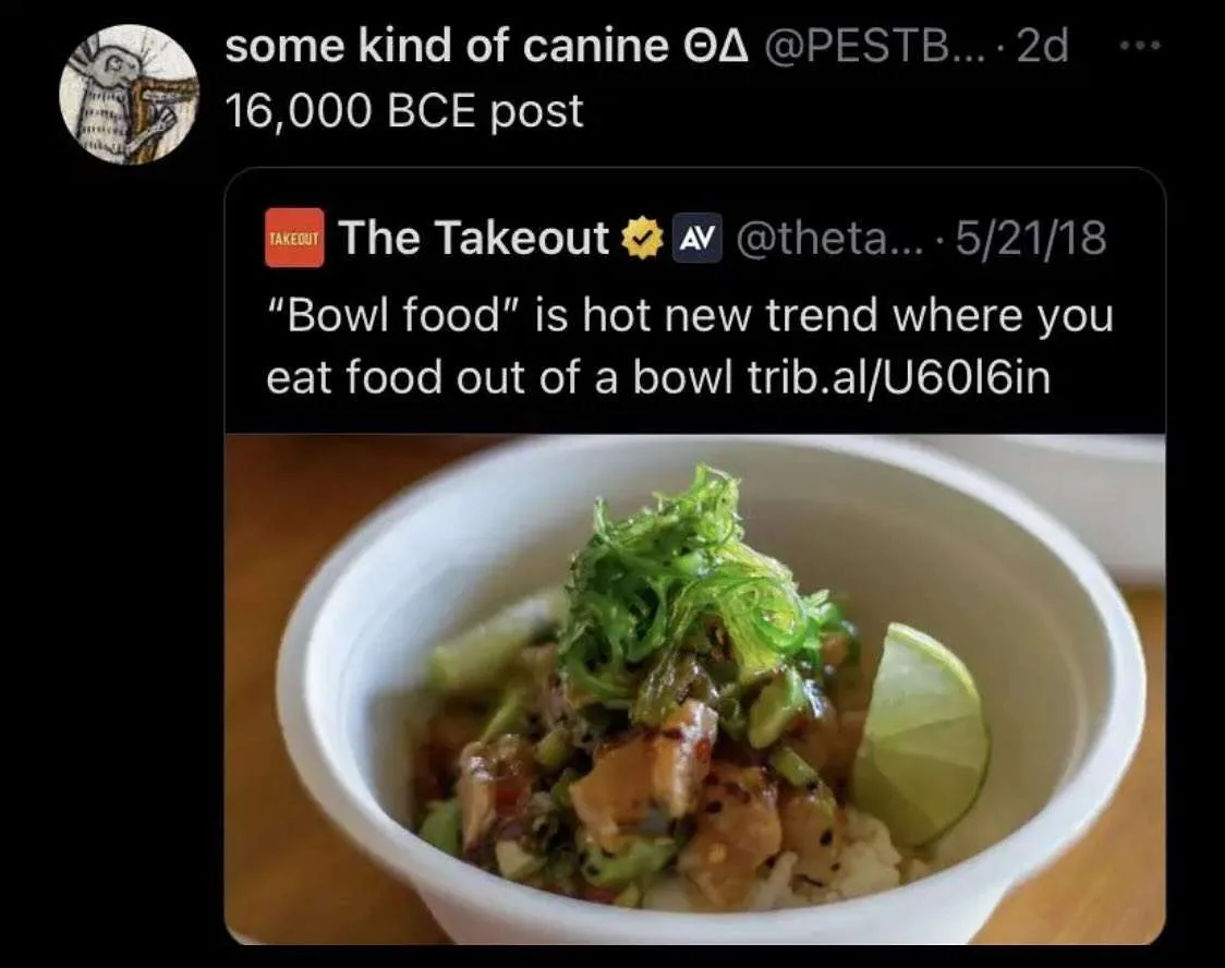 A screenshot of a 2018 tweet from The Takeout declaring 'bowl food' a hot new trend, overlaid on a photo of a colorful poke…