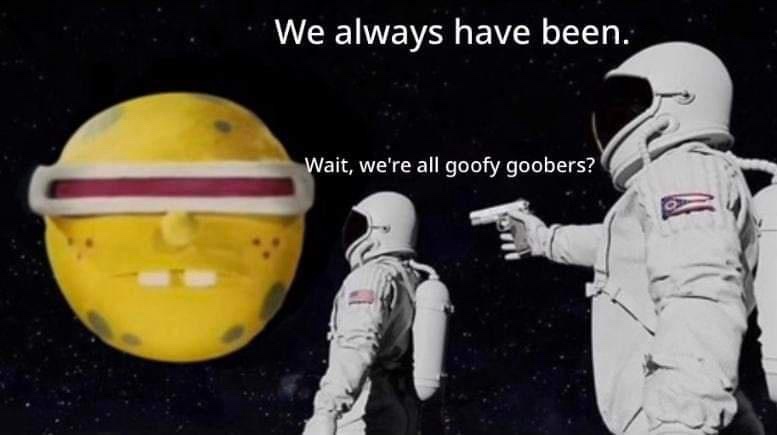 Two astronauts in space, one pointing a gun at the other, face a large yellow planet with a cartoonish face and a red visor…