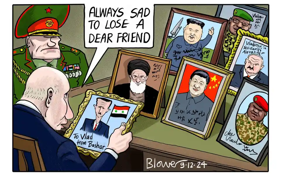A cartoon depicts Vladimir Putin sitting at a desk surrounded by framed portraits of world leaders including Kim Jong-un, Xi…